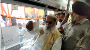 Transport Minister Anil Vij travels in bus after purchasing ticket